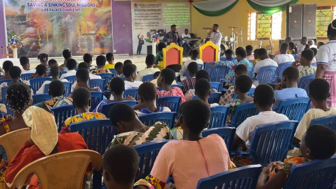 Children and adults attending worship in the church sanctuary