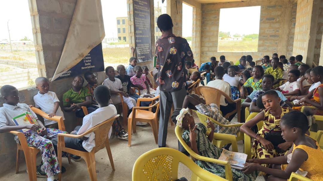 Children gathered for a ministry lesson in their classroom