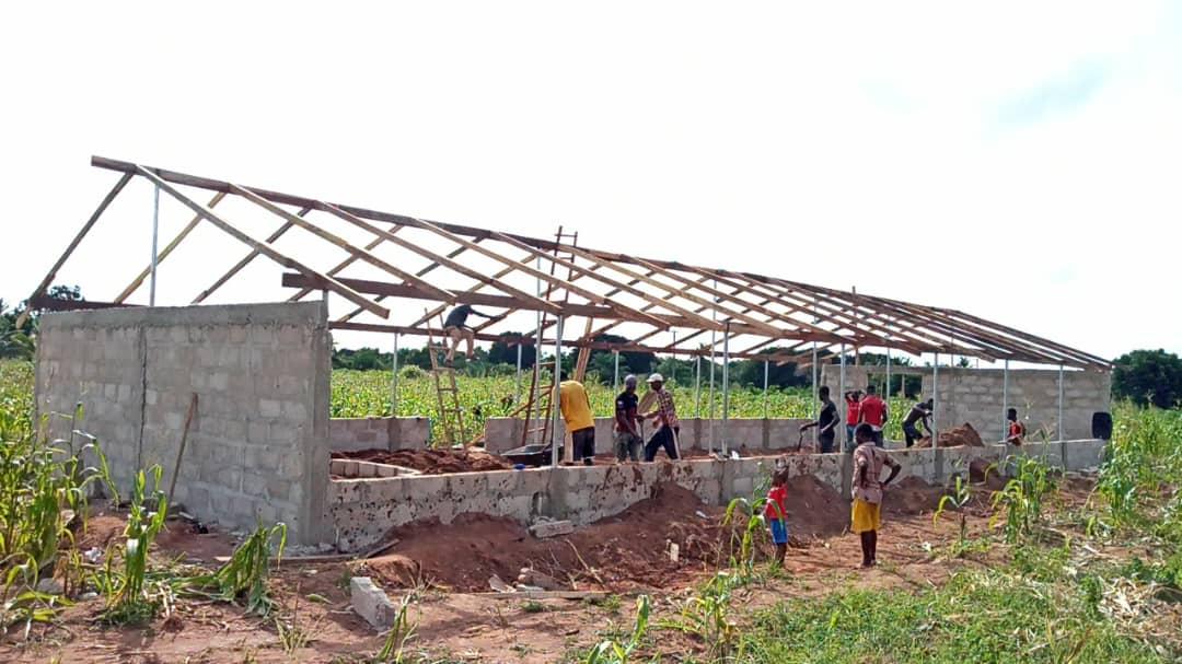 Church members building a new church meeting place